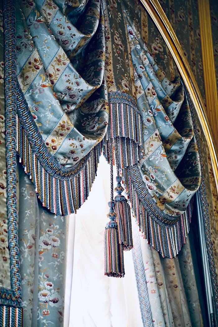gallery-5 Luxurious floral curtains with intricate tassel details bring a traditional touch to any interior.