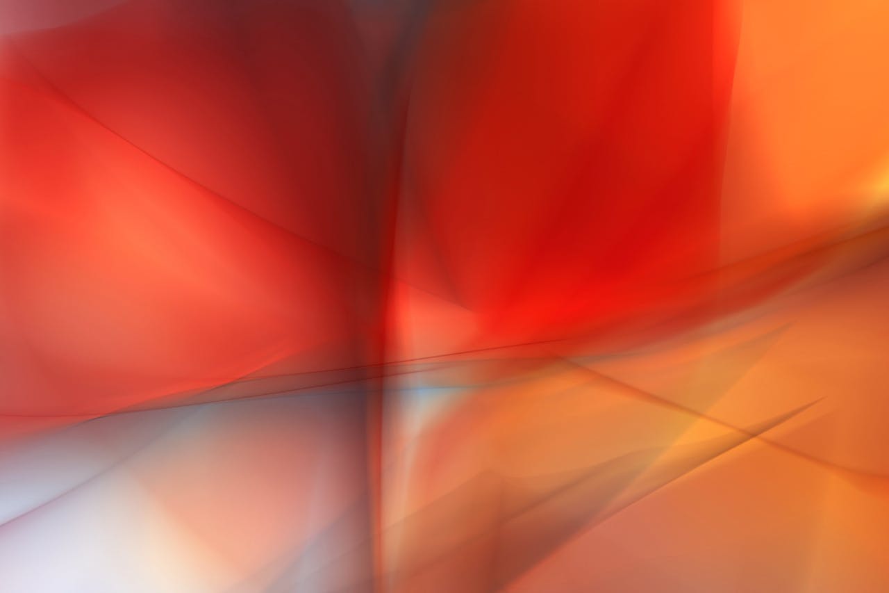 services-02 Dynamic abstract art featuring bold red and orange hues with fluid motion and depth.