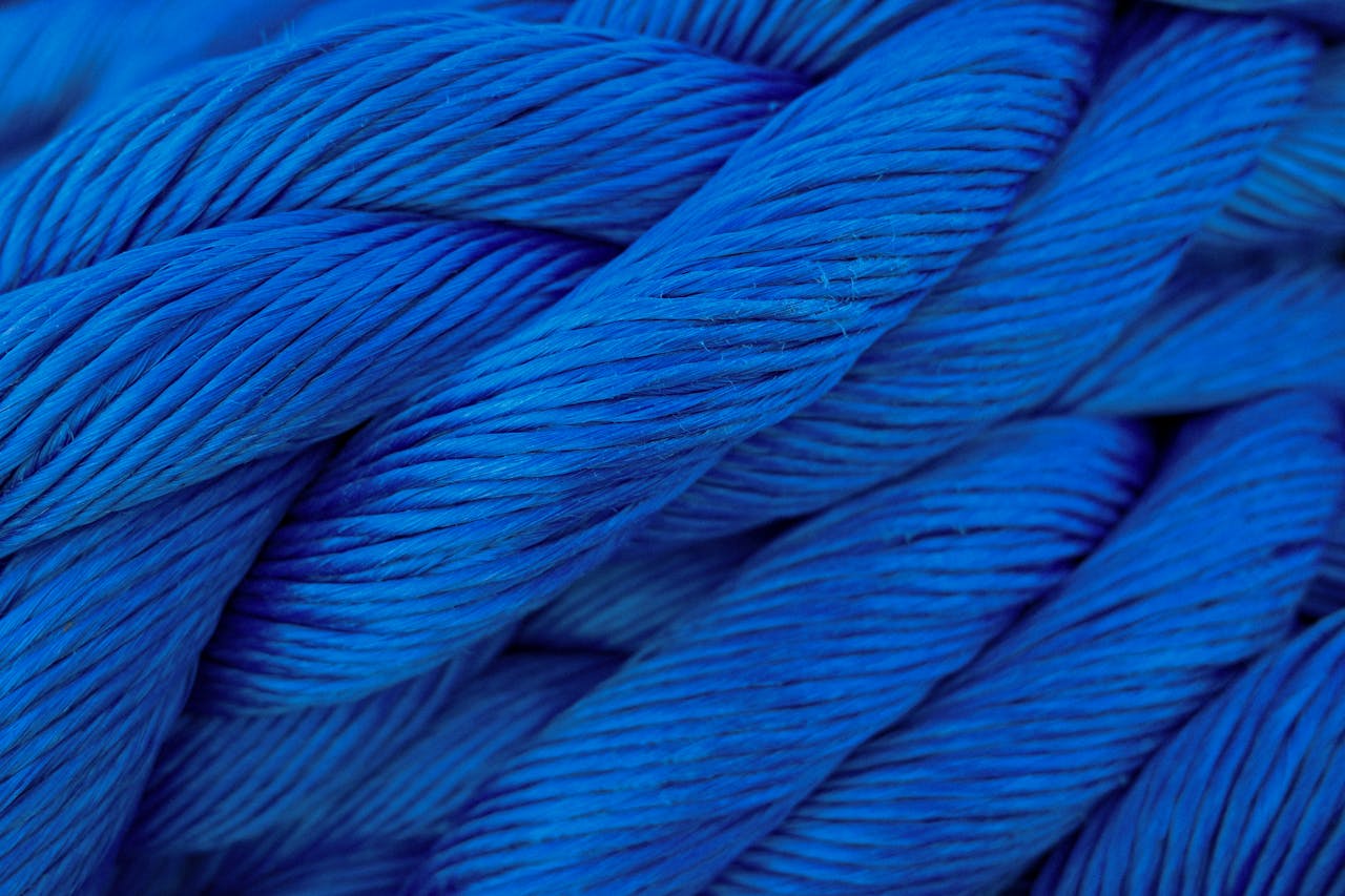 about-01 Detailed close-up of vibrant blue twisted cord showcasing texture.